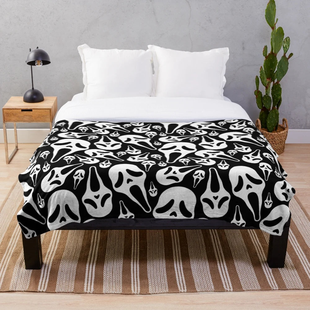 Ghostface plush blanket with spooky horror design