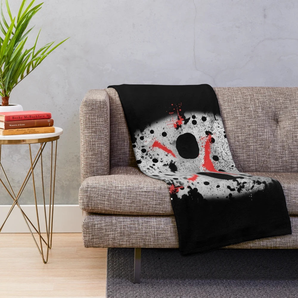 Plush blanket featuring the iconic Jason Voorhees character from the Friday the 13th horror movie franchise