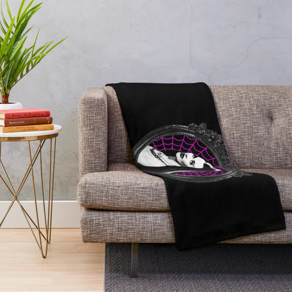 A cozy and chilling plush blanket featuring a vintage horror-inspired design
