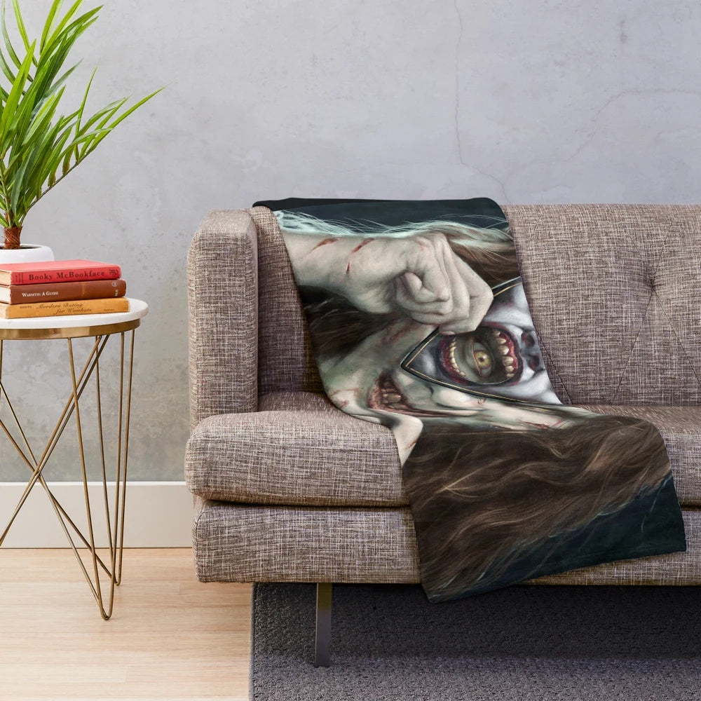 Plush blanket with Regan's Game horror movie-inspired design