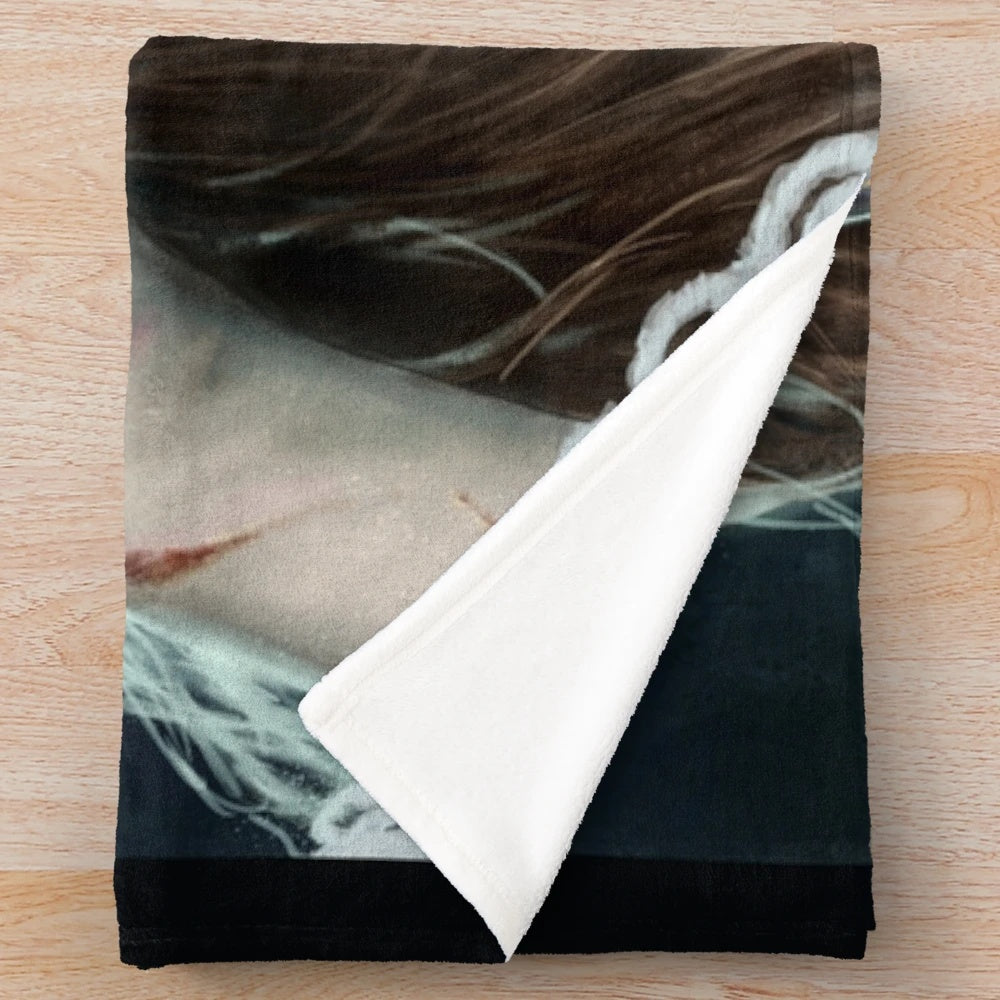 Plush blanket with Regan's Game horror movie-inspired design