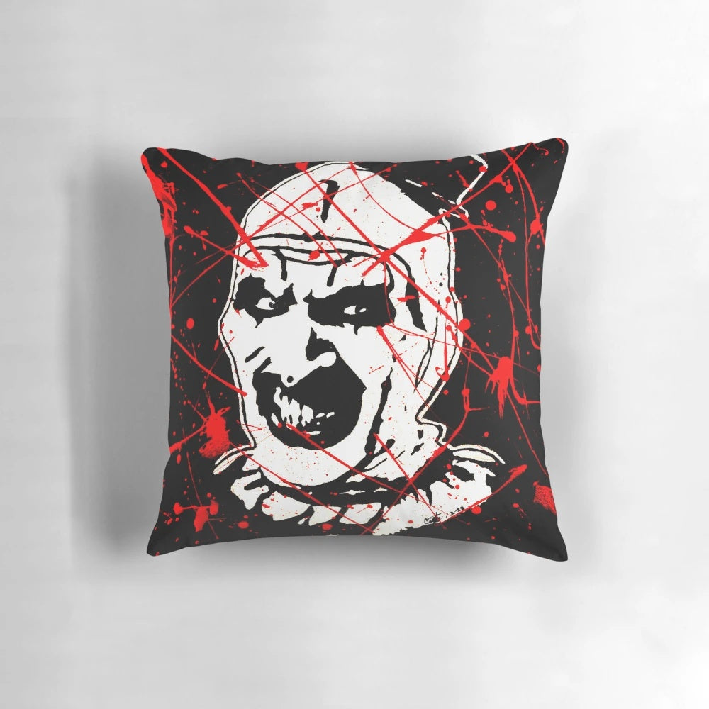 A Terrifier-themed pillow featuring a creepy clown design for horror movie enthusiasts