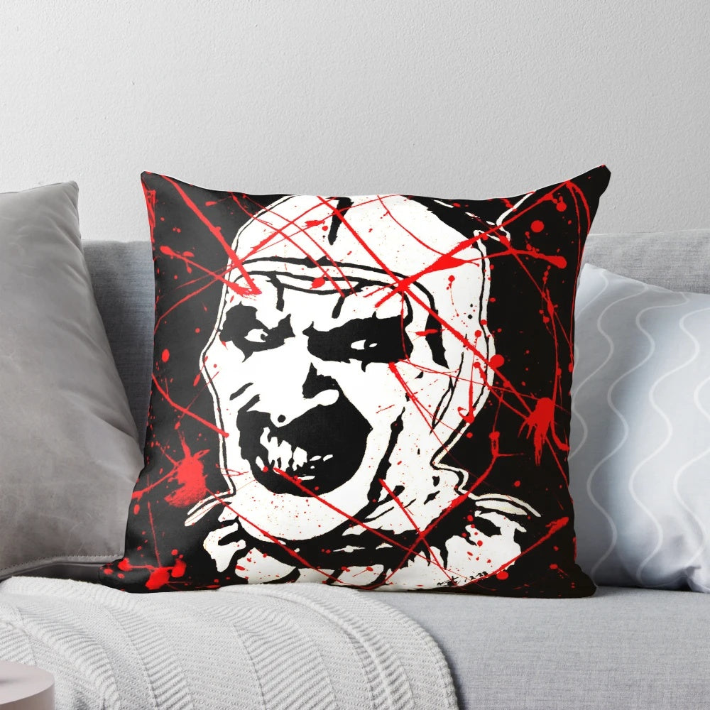 A Terrifier-themed pillow featuring a creepy clown design for horror movie enthusiasts