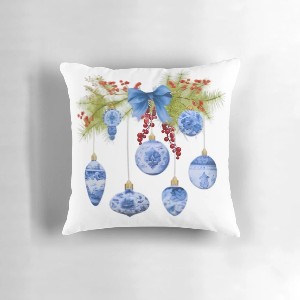 Elegant chinoiserie-style Christmas holiday pillow with blue and white pine swag branches