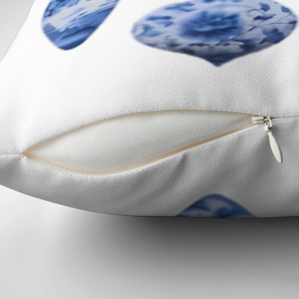 Elegant chinoiserie-style Christmas holiday pillow with blue and white pine swag branches