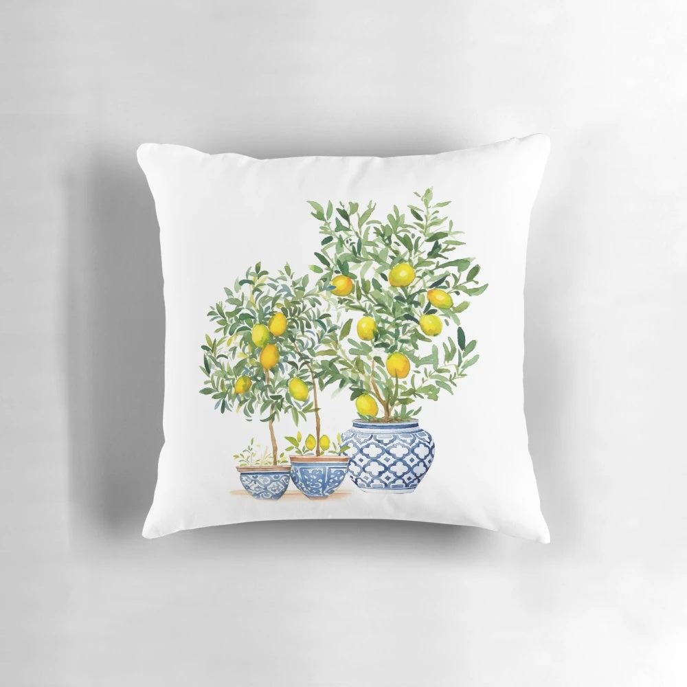 A Chinoiserie-inspired decorative pillow featuring a lemon tree pattern in shades of blue and white.
