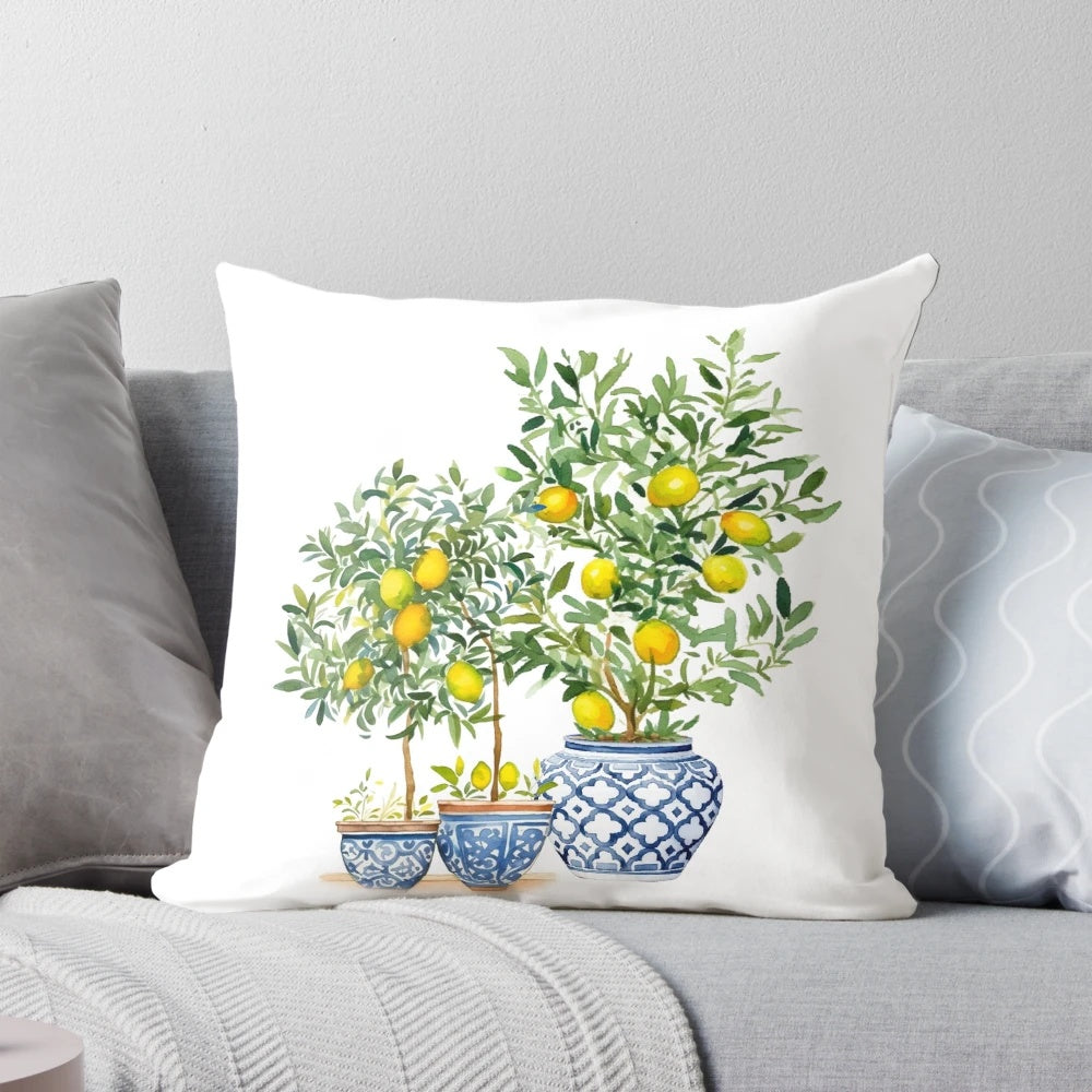 A Chinoiserie-inspired decorative pillow featuring a lemon tree pattern in shades of blue and white.