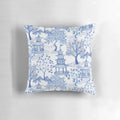 A blue and white throw pillow featuring a chinoiserie-style pagoda forest pattern.