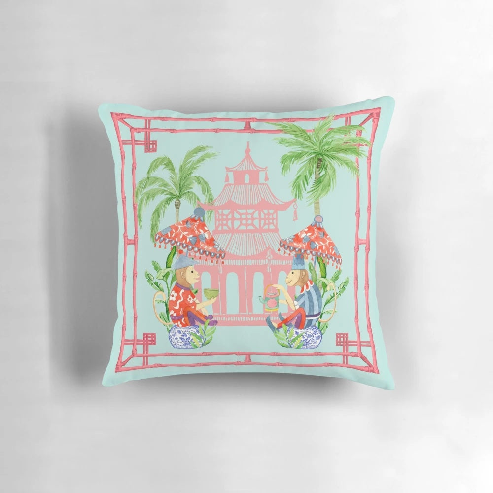 Chinoiserie-style decorative throw pillow featuring a watercolor painting of a monkey and pagoda in blue and white tones.