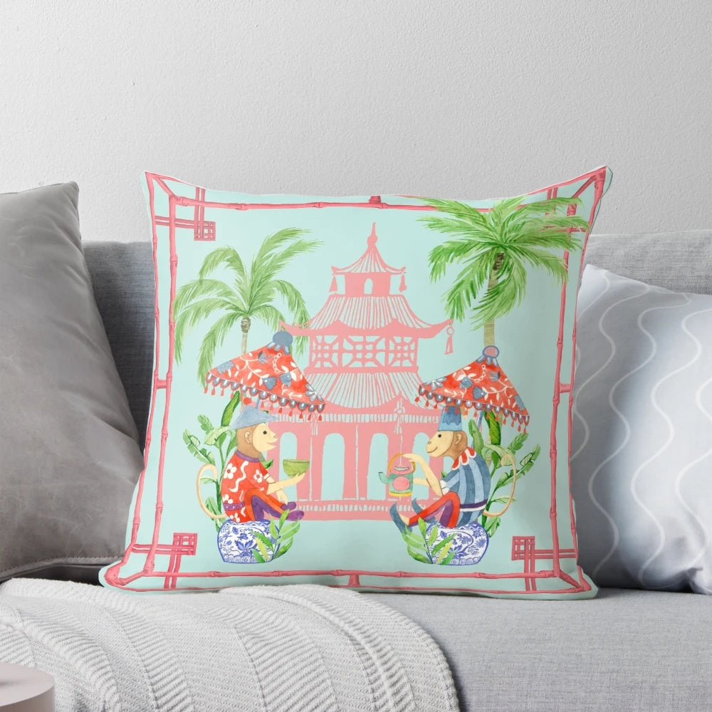 Chinoiserie-style decorative throw pillow featuring a watercolor painting of a monkey and pagoda in blue and white tones.