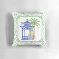 Chinoiserie-style pillow with pagoda, palm tree, and leopard print design in blue and white color scheme