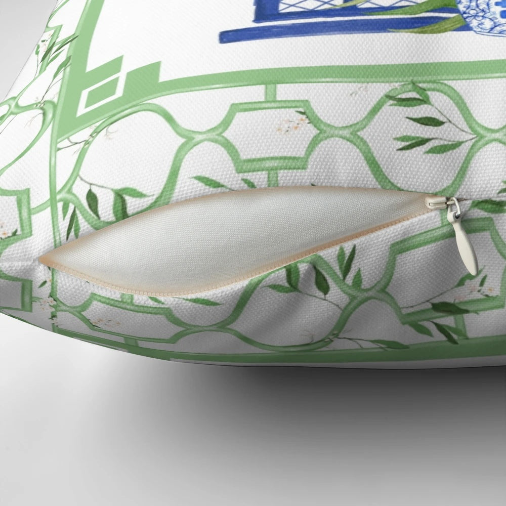 Chinoiserie-style pillow with pagoda, palm tree, and leopard print design in blue and white color scheme