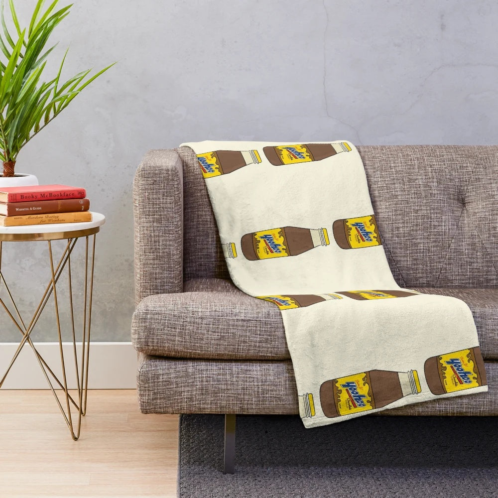 Chocolate drink themed plush blanket with Yoo-hoo inspired design and drink illustration