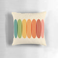Colorful, geometric throw pillow with a horizontal pattern of overlapping ovals in a rainbow of colors.