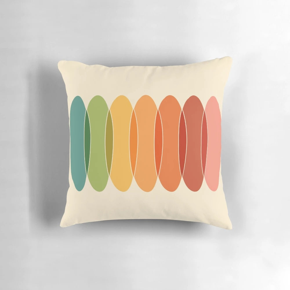 Colorful, geometric throw pillow with a horizontal pattern of overlapping ovals in a rainbow of colors.