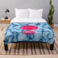 Chromatica-inspired plush blanket with a tie-dye graphic design featuring the Chromatica logo