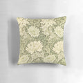 Closeup of a yellow chrysanthemum flower on a William Morris inspired floral pillow
