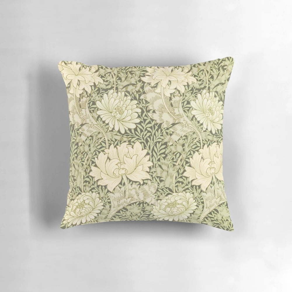 Closeup of a yellow chrysanthemum flower on a William Morris inspired floral pillow