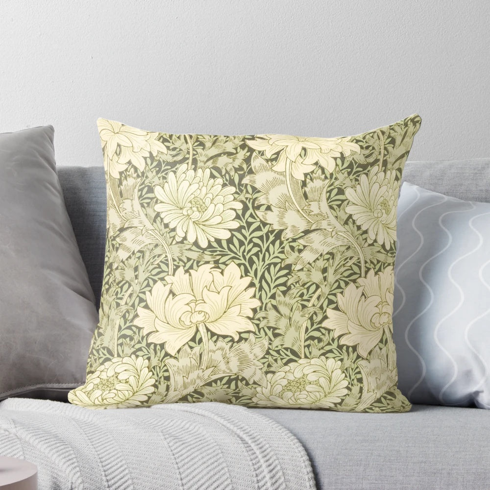 Closeup of a yellow chrysanthemum flower on a William Morris inspired floral pillow