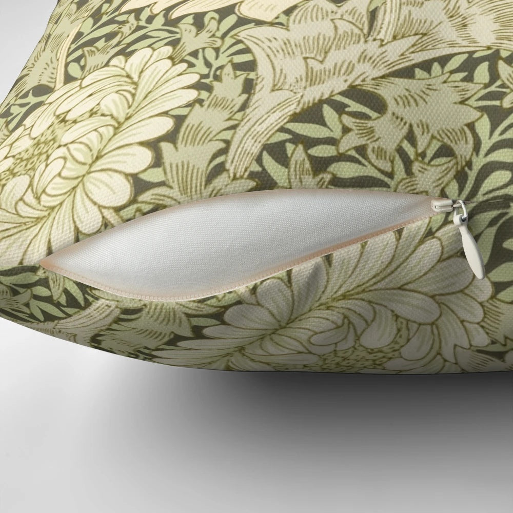 Closeup of a yellow chrysanthemum flower on a William Morris inspired floral pillow