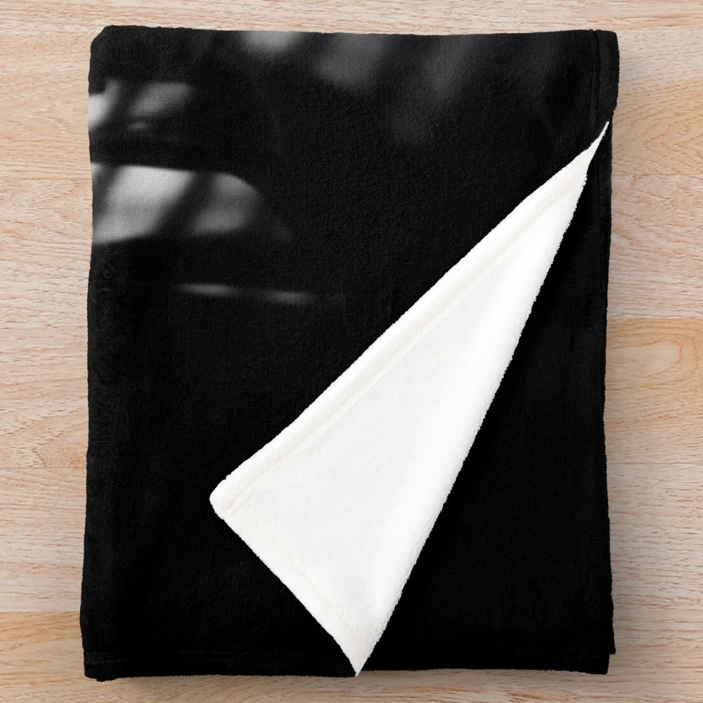 Noir-inspired plush blanket with dramatic chiaroscuro lighting and vintage cinematic aesthetic