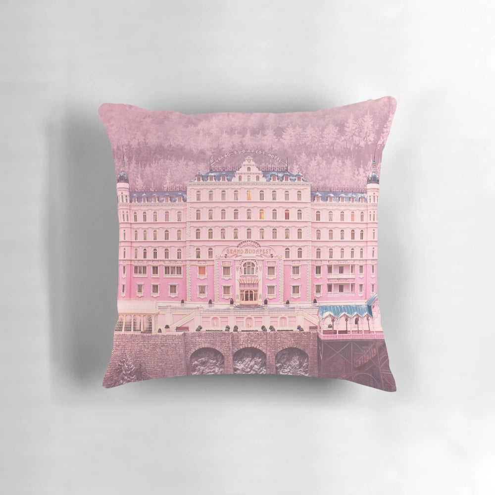 Decorative pillow featuring iconic scenes and characters from The Grand Budapest Hotel movie.