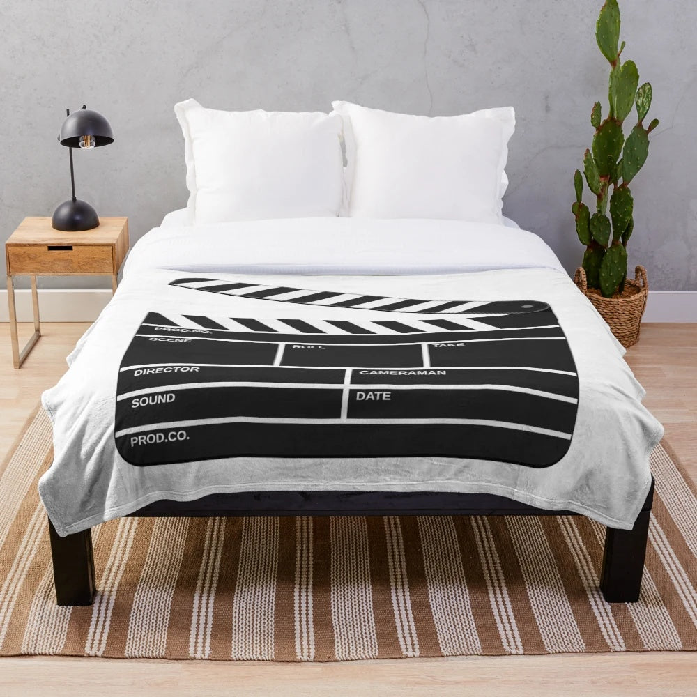 Cinematic plush blanket with film reel design