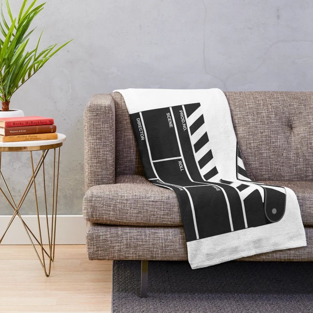 Cinematic plush blanket with film reel design