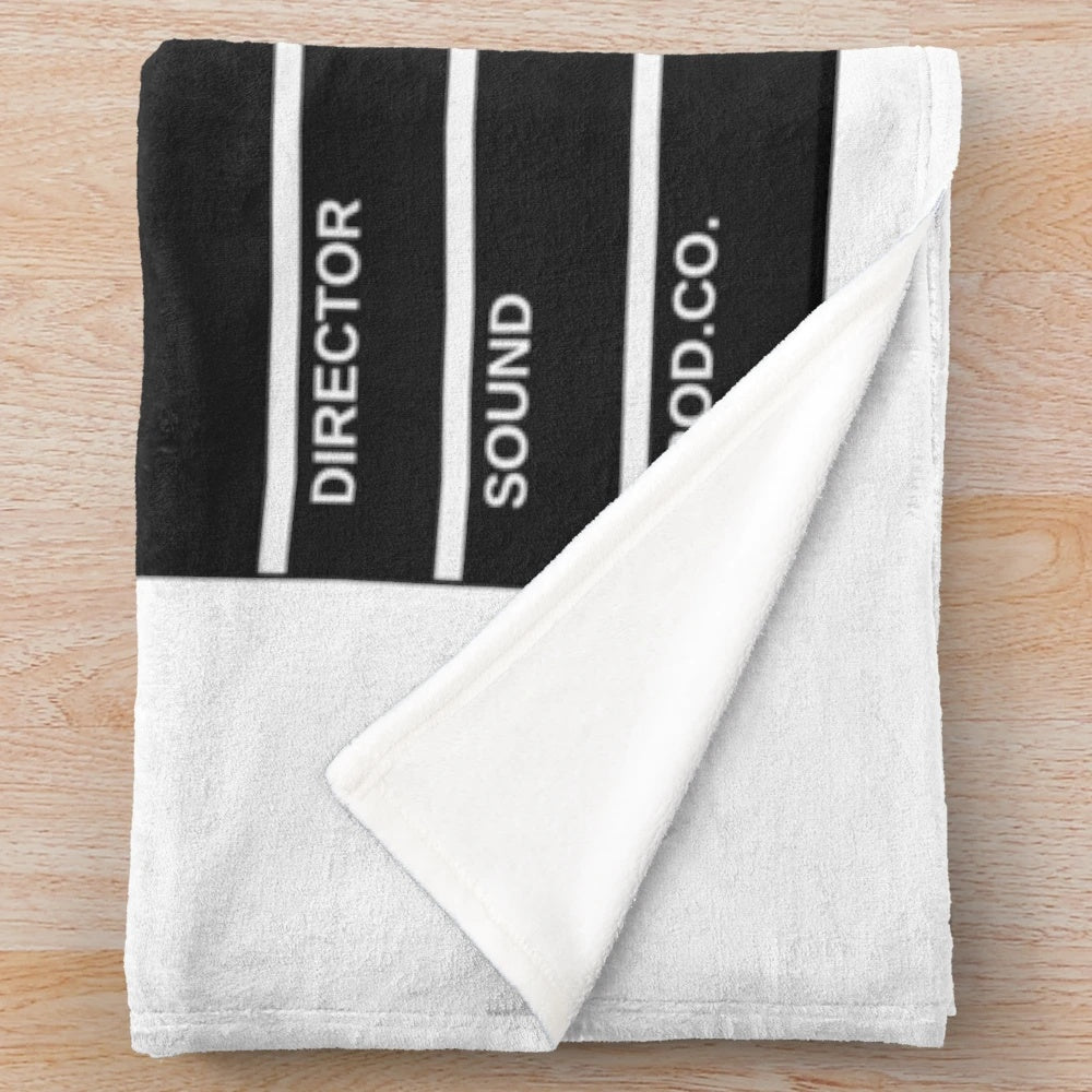 Cinematic plush blanket with film reel design
