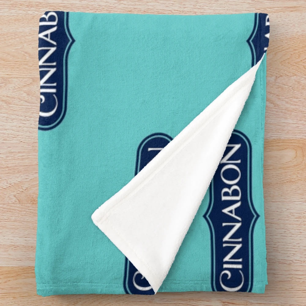 Cinnabon-inspired plush blanket with restaurant-themed design