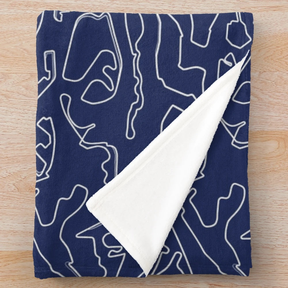 Plush blanket with a circuits pattern design on a blue background
