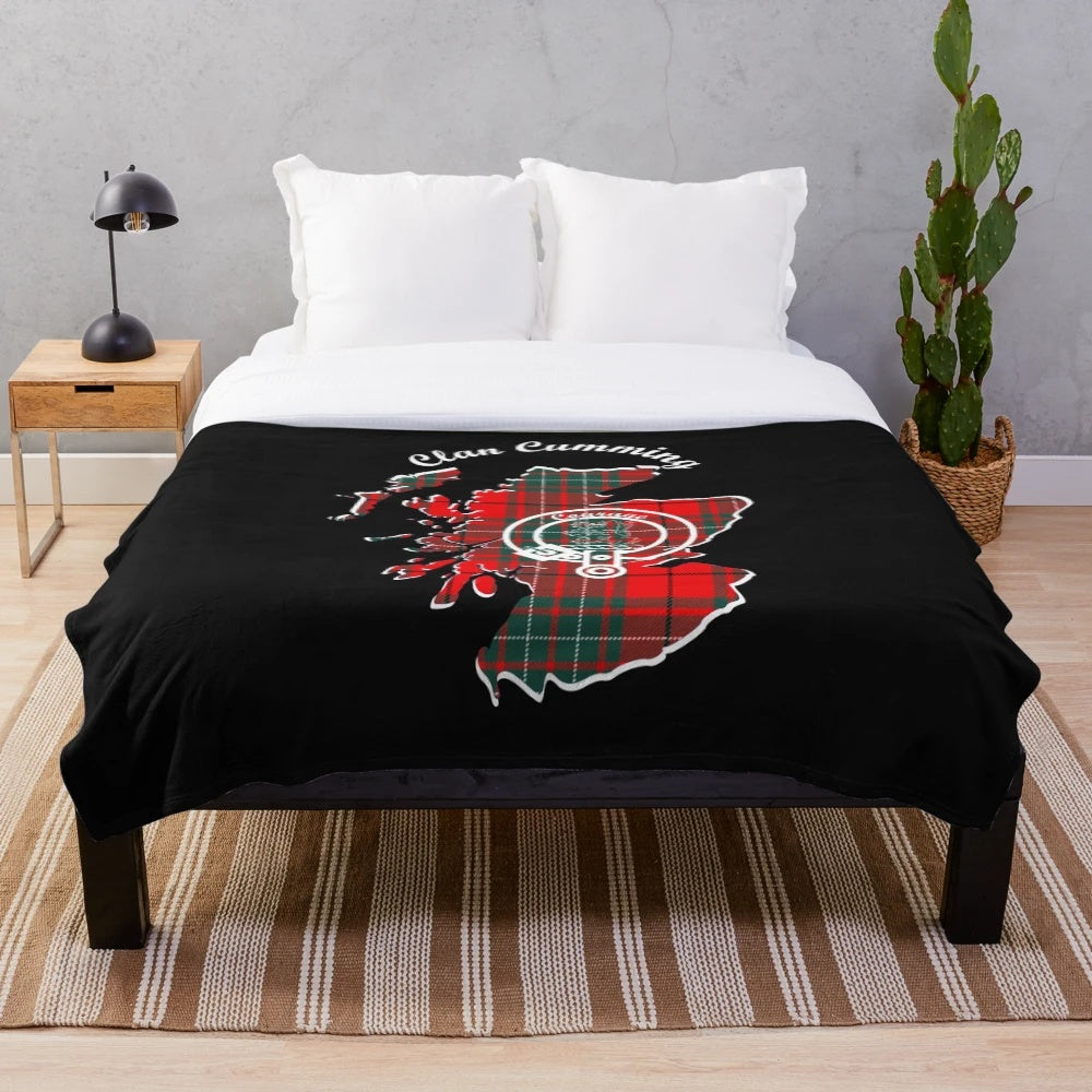 Plush blanket featuring a clan crest, Scottish map, and tartan design