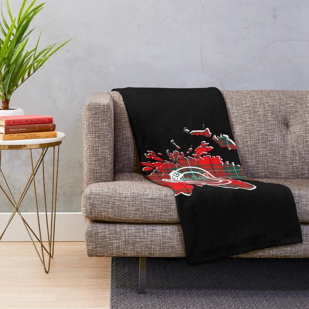 Plush blanket featuring a clan crest, Scottish map, and tartan design