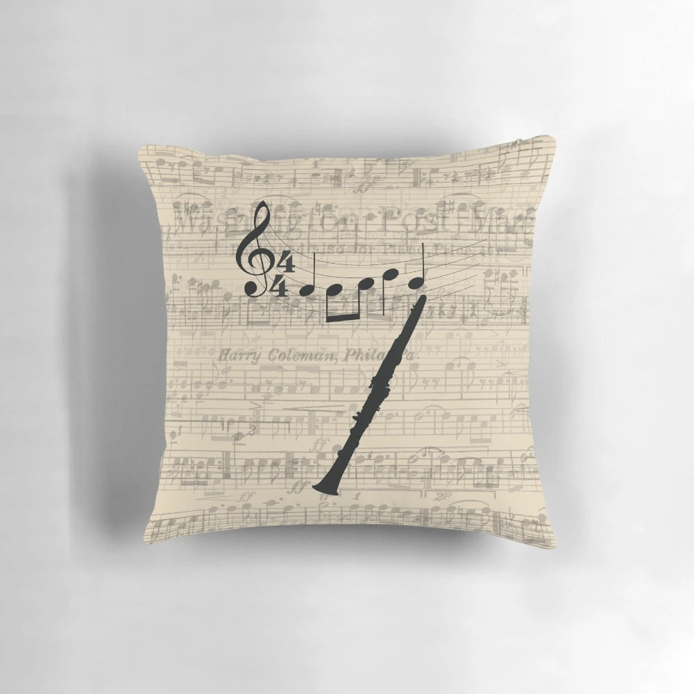 Clarinet-shaped pillow with sheet music design, perfect for musicians and music lovers.