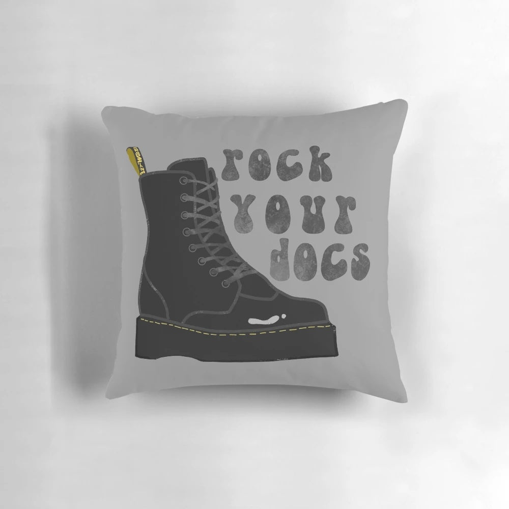 A plush Doc Martens inspired pillow with the iconic black and yellow stitching design.