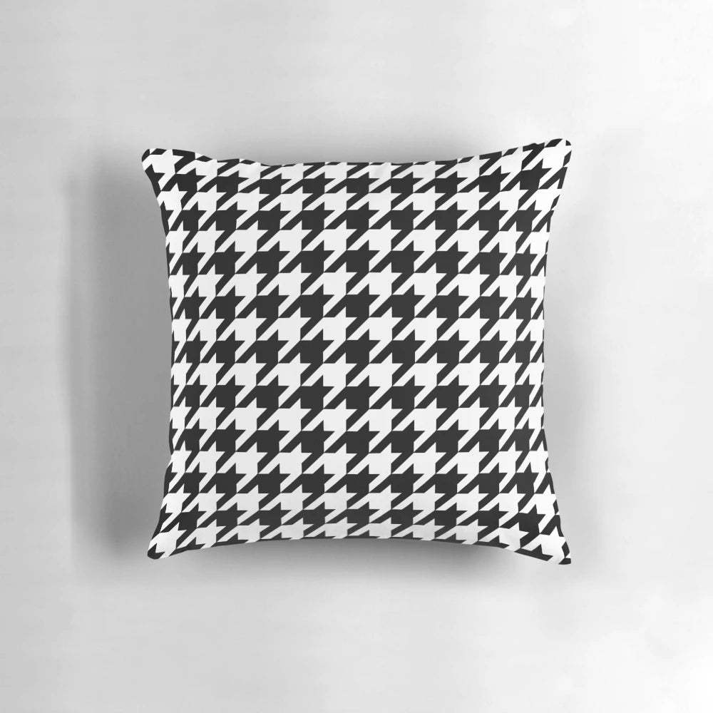 Black and white houndstooth patterned decorative pillow