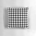 Black and white houndstooth patterned decorative pillow