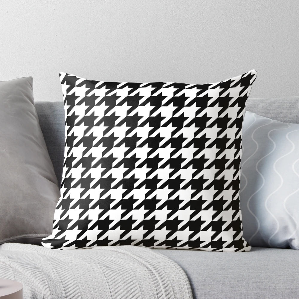 Black and white houndstooth patterned decorative pillow