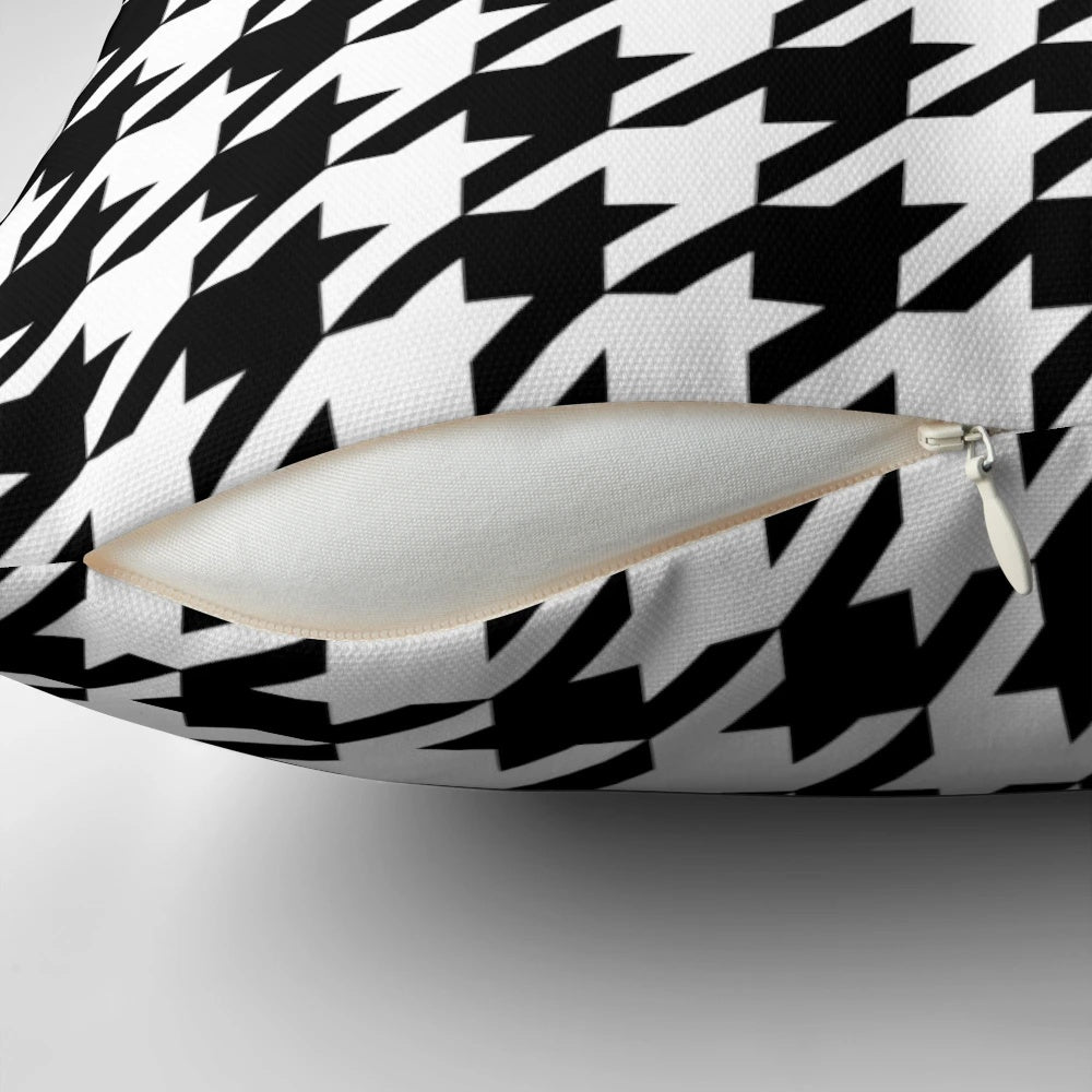 Black and white houndstooth patterned decorative pillow