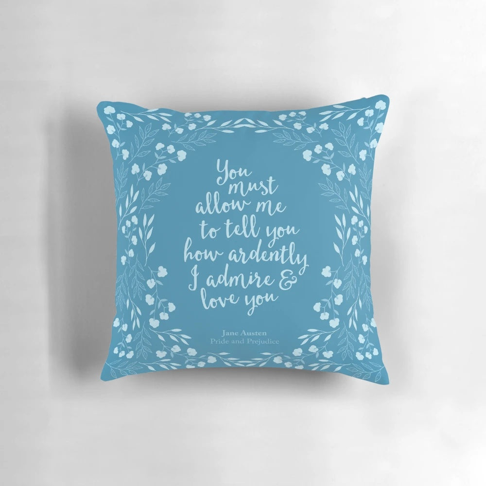 A floral pillow featuring a quote from Jane Austen's Pride and Prejudice, perfect for bookworms and literary enthusiasts.