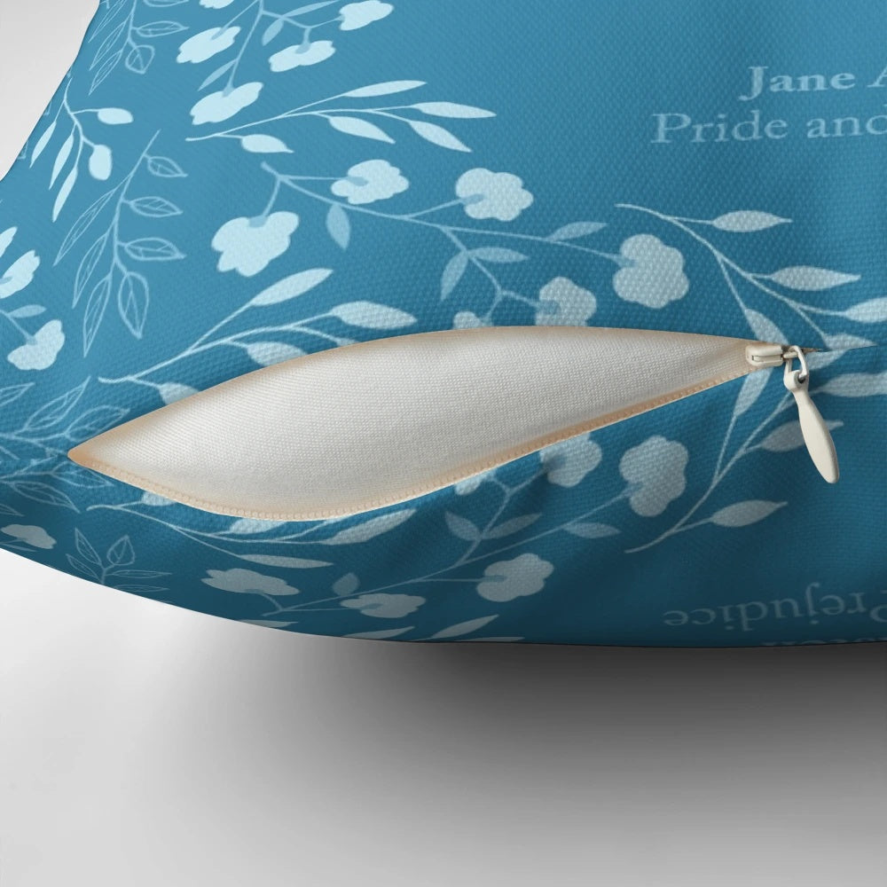 A floral pillow featuring a quote from Jane Austen's Pride and Prejudice, perfect for bookworms and literary enthusiasts.