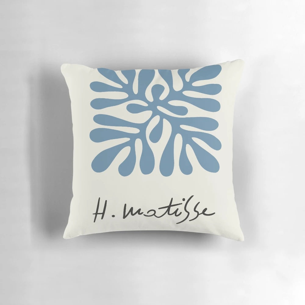 A decorative pillow featuring a classic henri matisse painting-inspired abstract woman artwork