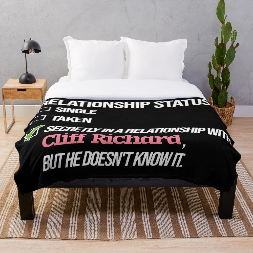 Cliff Richard-inspired plush blanket with humorous couple design