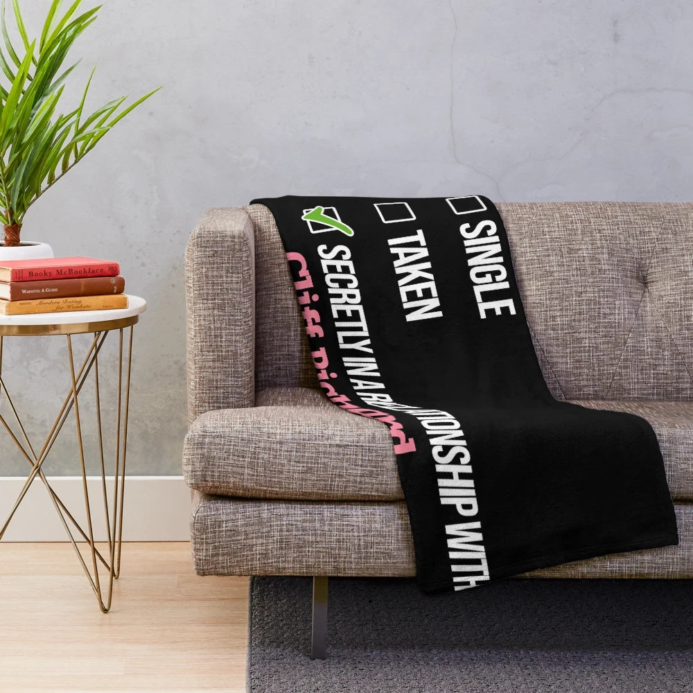 Cliff Richard-inspired plush blanket with humorous couple design