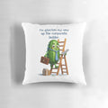 Gherkin-shaped pillow with text "I'm gherkin my way up the corporate ladder