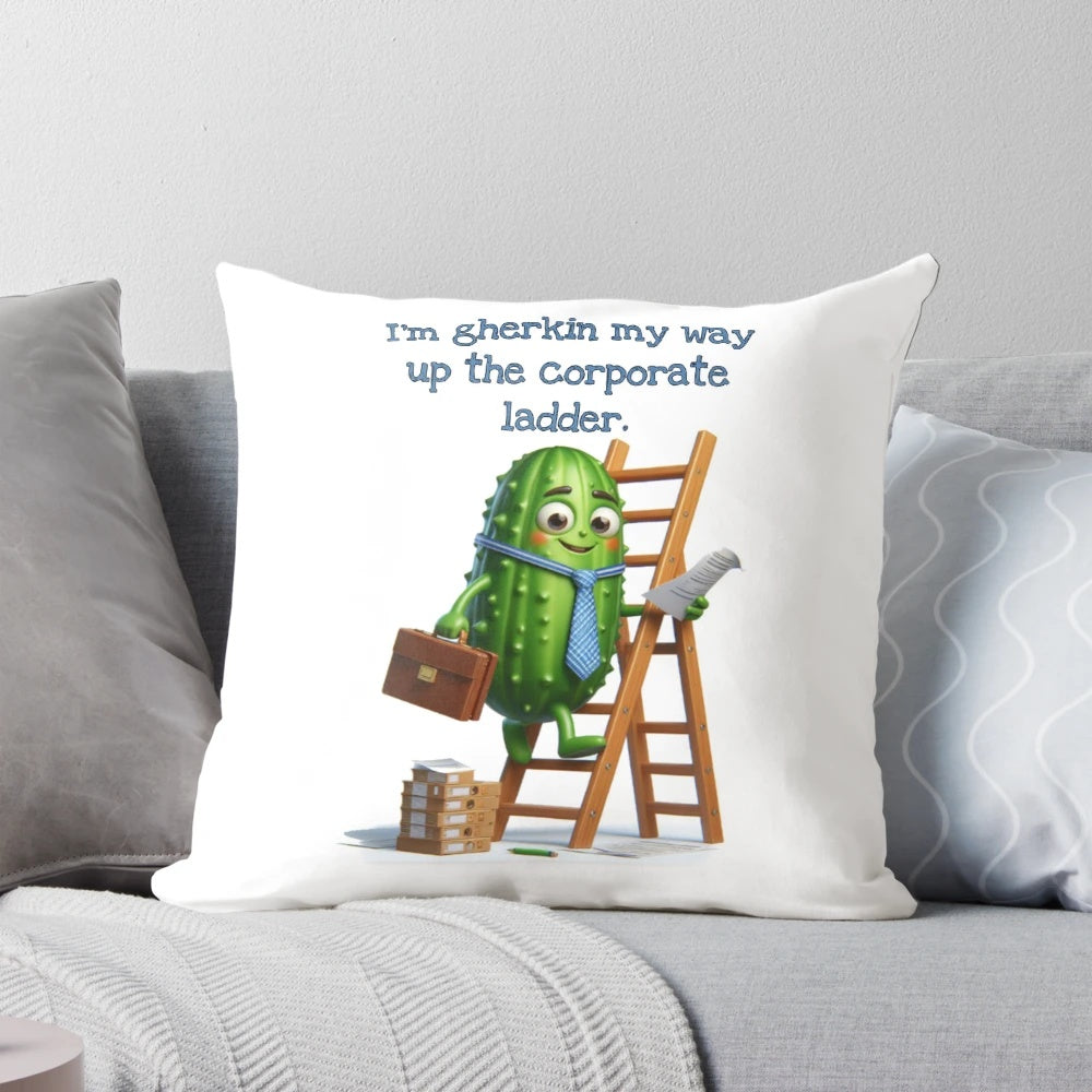 Gherkin-shaped pillow with text "I'm gherkin my way up the corporate ladder