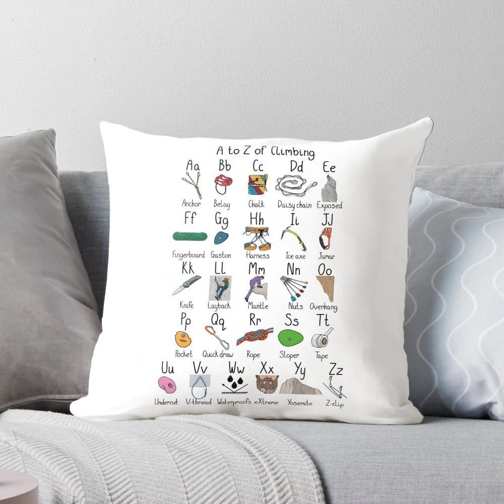 A decorative pillow featuring the alphabet in a climbing-inspired design, perfect for rock climbing enthusiasts.