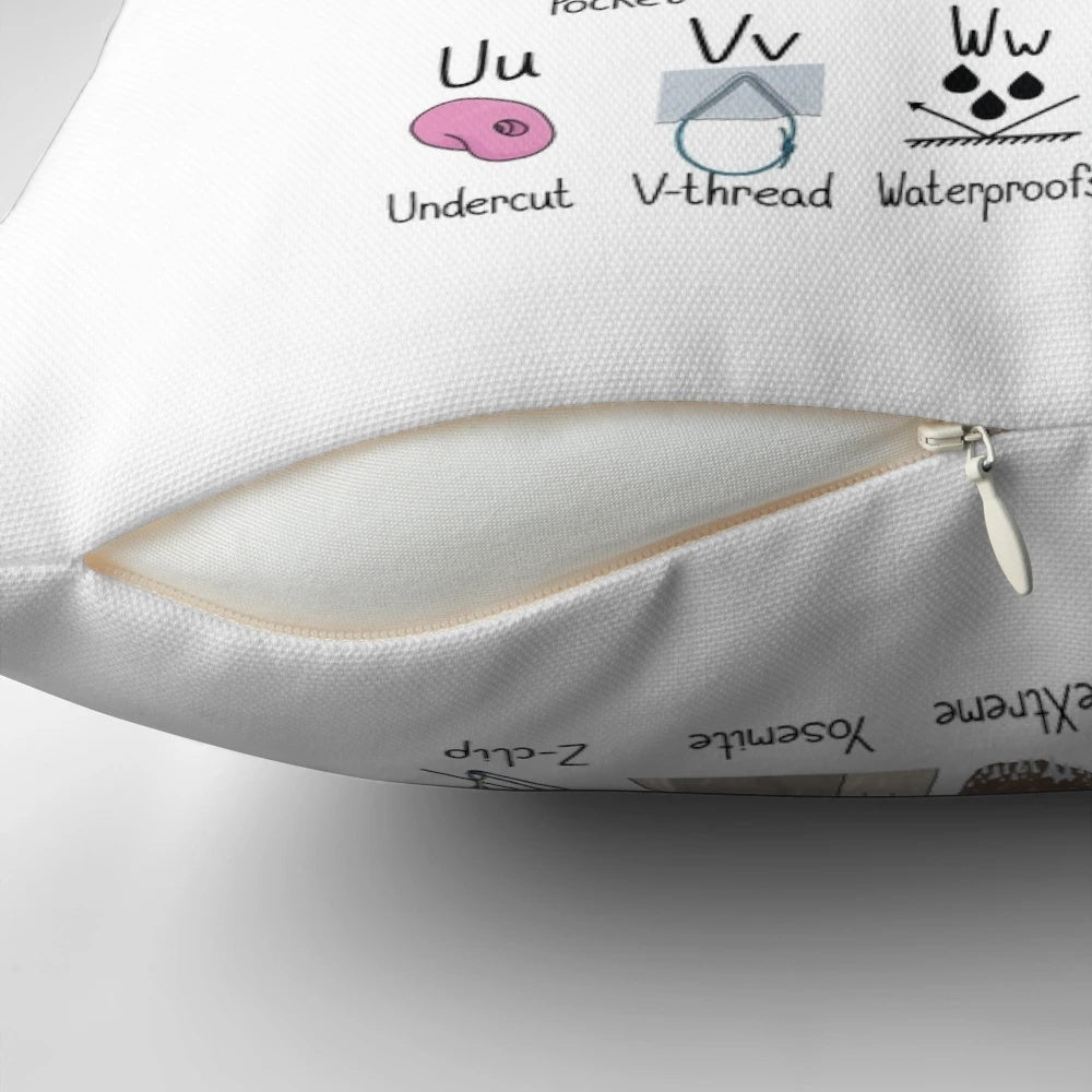 A decorative pillow featuring the alphabet in a climbing-inspired design, perfect for rock climbing enthusiasts.