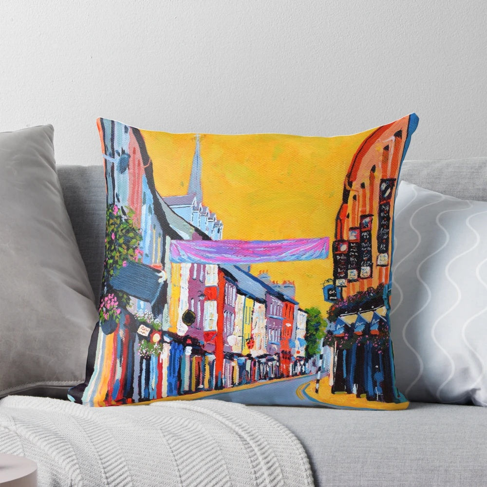 Vibrant yellow buildings and shops on Pearse Street, Clonakilty, County Cork, Ireland