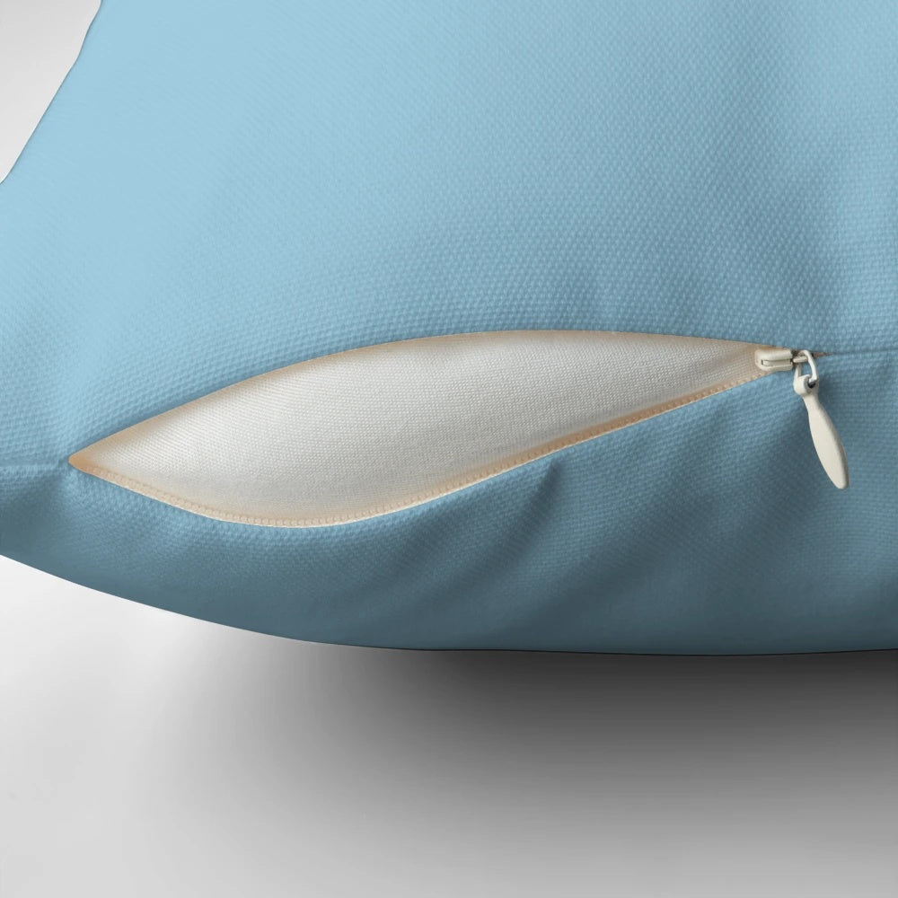 A cozy blue cloud-shaped pillow, ideal for adding a playful touch to any office or home setup.